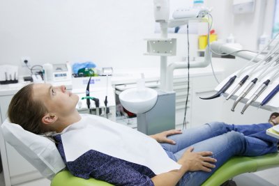 Person sitting in dentist chair